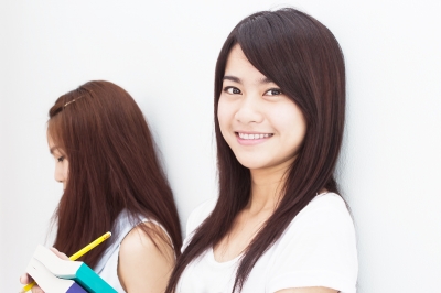 Asian High School Girl with Books