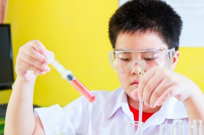 Kid Doing Science Experiment